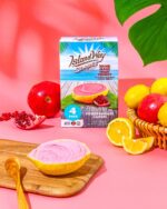 Pack Island Way Citron et Grenade au Maroc, décoré de fruits frais et ambiance estivale colorée sur fond rose